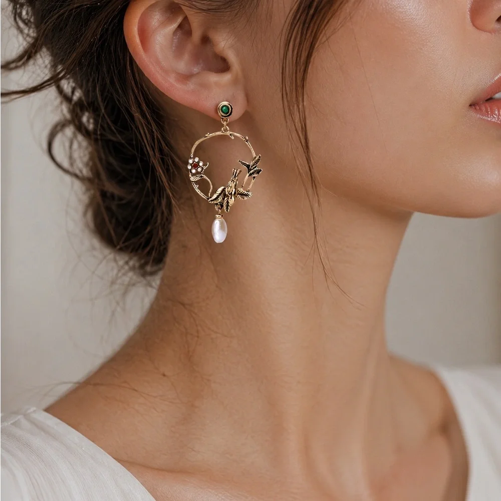 Anthropologie Gold-Tone Hummingbird Hoop Earrings with Green and Pearl Accents